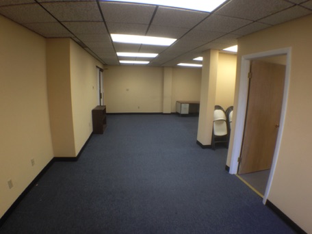 The office has new carpets, a large room and a private office The office has new carpets, a large room and a private office
